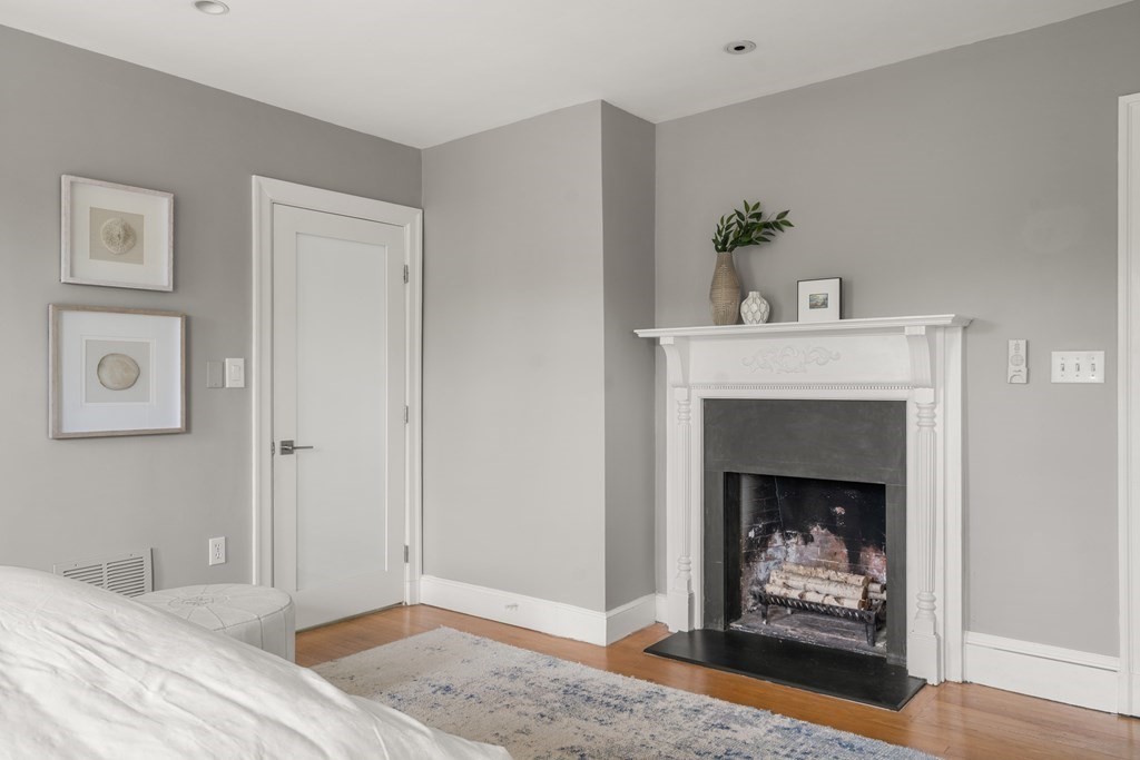 79 University Road, Unit 2 Brookline, MA 02445 - Photo 15 of 35 a living room with furniture and a fireplace