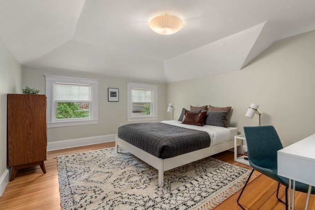79 University Road, Unit 2 Brookline, MA 02445 - Photo 20 of 35 a bedroom with a bed lamp and a window