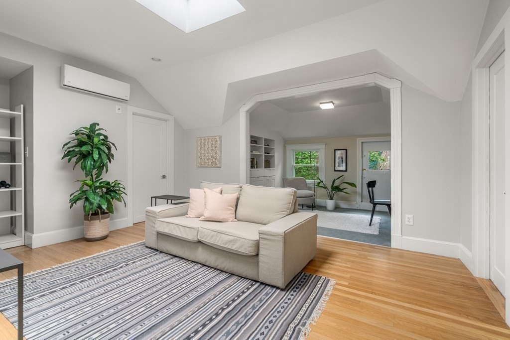 79 University Road, Unit 2 Brookline, MA 02445 - Photo 23 of 35 a living room with furniture and a potted plant