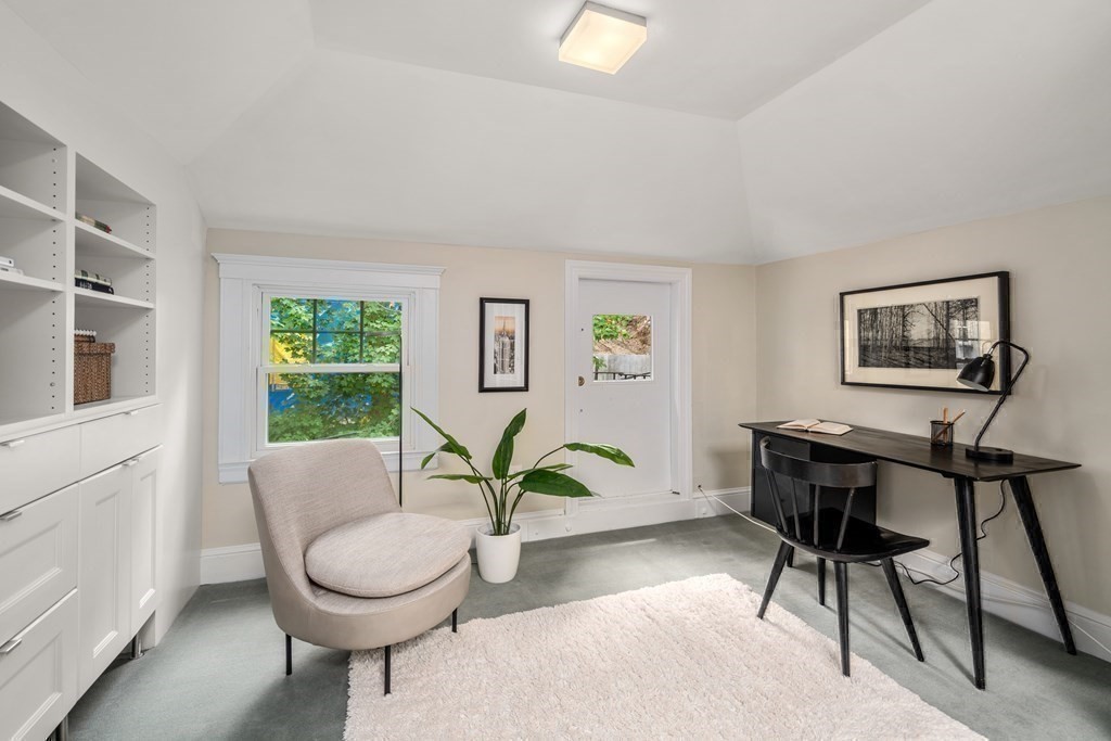 79 University Road, Unit 2 Brookline, MA 02445 - Photo 25 of 35 a living room with furniture and a wooden floor