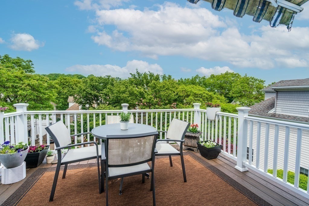 79 University Road, Unit 2 Brookline, MA 02445 - Photo 3 of 35 a view of a two chairs and table in the balcony