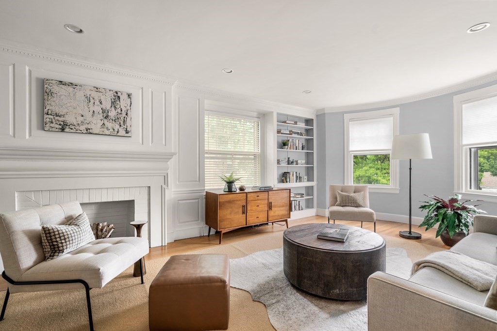 79 University Road, Unit 2 Brookline, MA 02445 - Photo 4 of 35 a living room with furniture and a fireplace