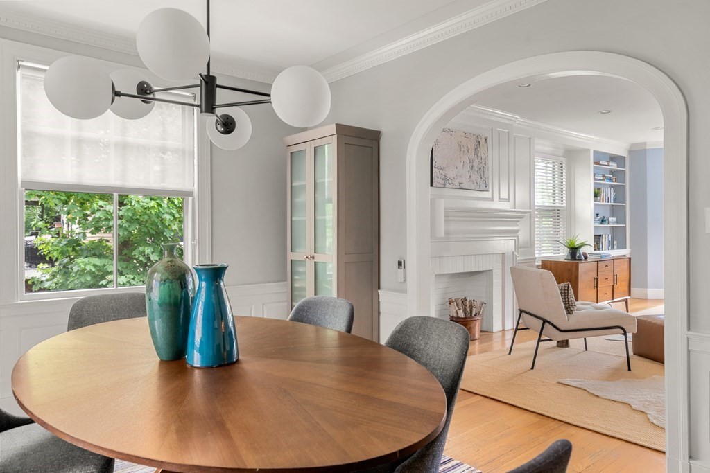 79 University Road, Unit 2 Brookline, MA 02445 - Photo 7 of 35 a view of a dining room with furniture and wooden floor