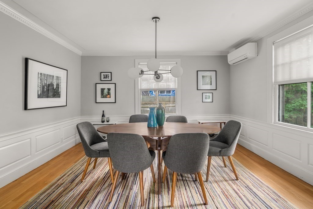 79 University Road, Unit 2 Brookline, MA 02445 - Photo 8 of 35 a view of a dining room with furniture window and wooden floor