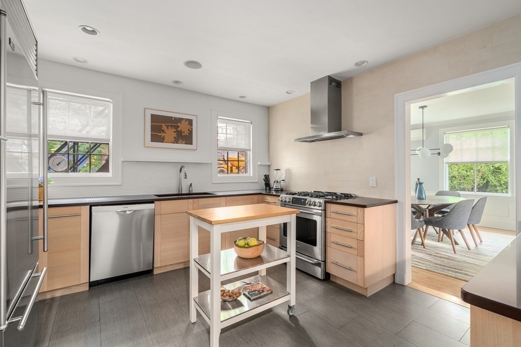 79 University Road, Unit 2 Brookline, MA 02445 - Photo 9 of 35 a kitchen with stainless steel appliances a stove a sink and a refrigerator