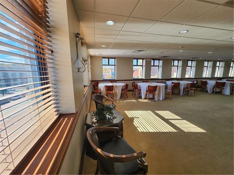 19 East Washington Street New Castle, PA 16101 - Photo 13 of 16 a living room with furniture and a floor to ceiling window