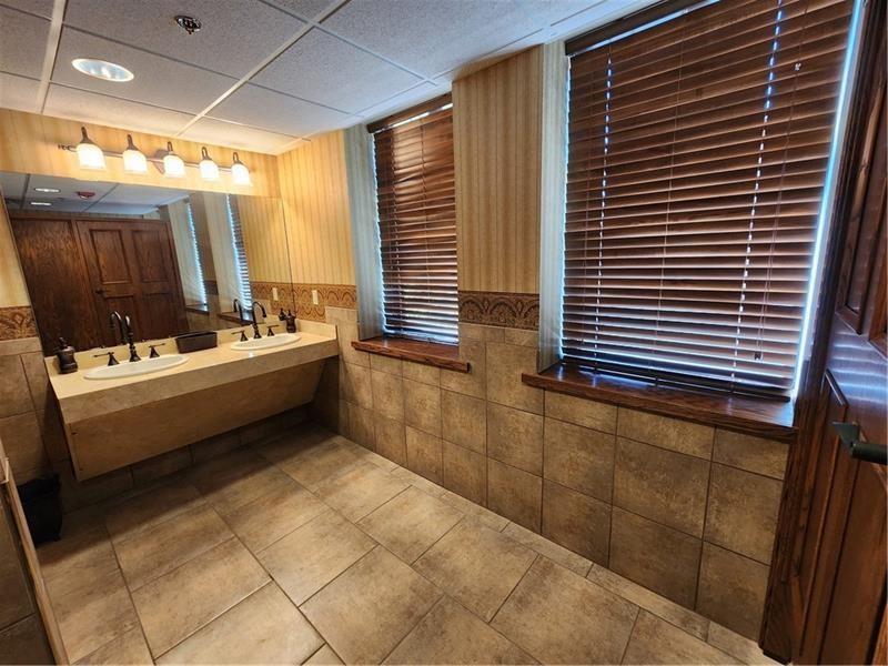 19 East Washington Street New Castle, PA 16101 - Photo 16 of 16 a bathroom with a sink a toilet and shower