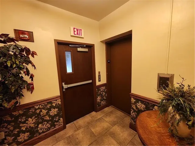 a view of entryway with wooden floor