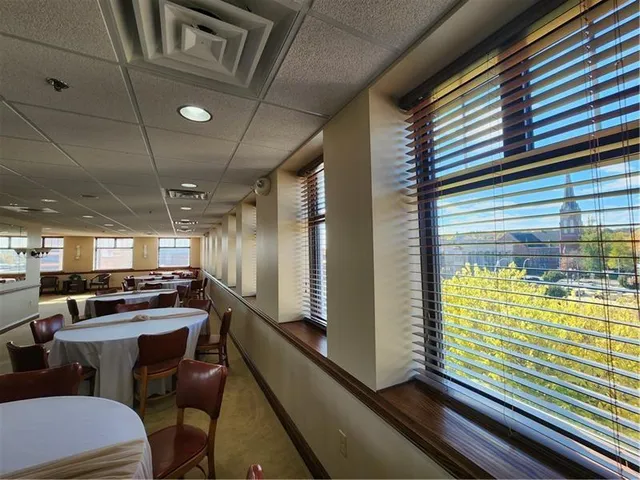 a dining room with furniture a rug and wooden floor
