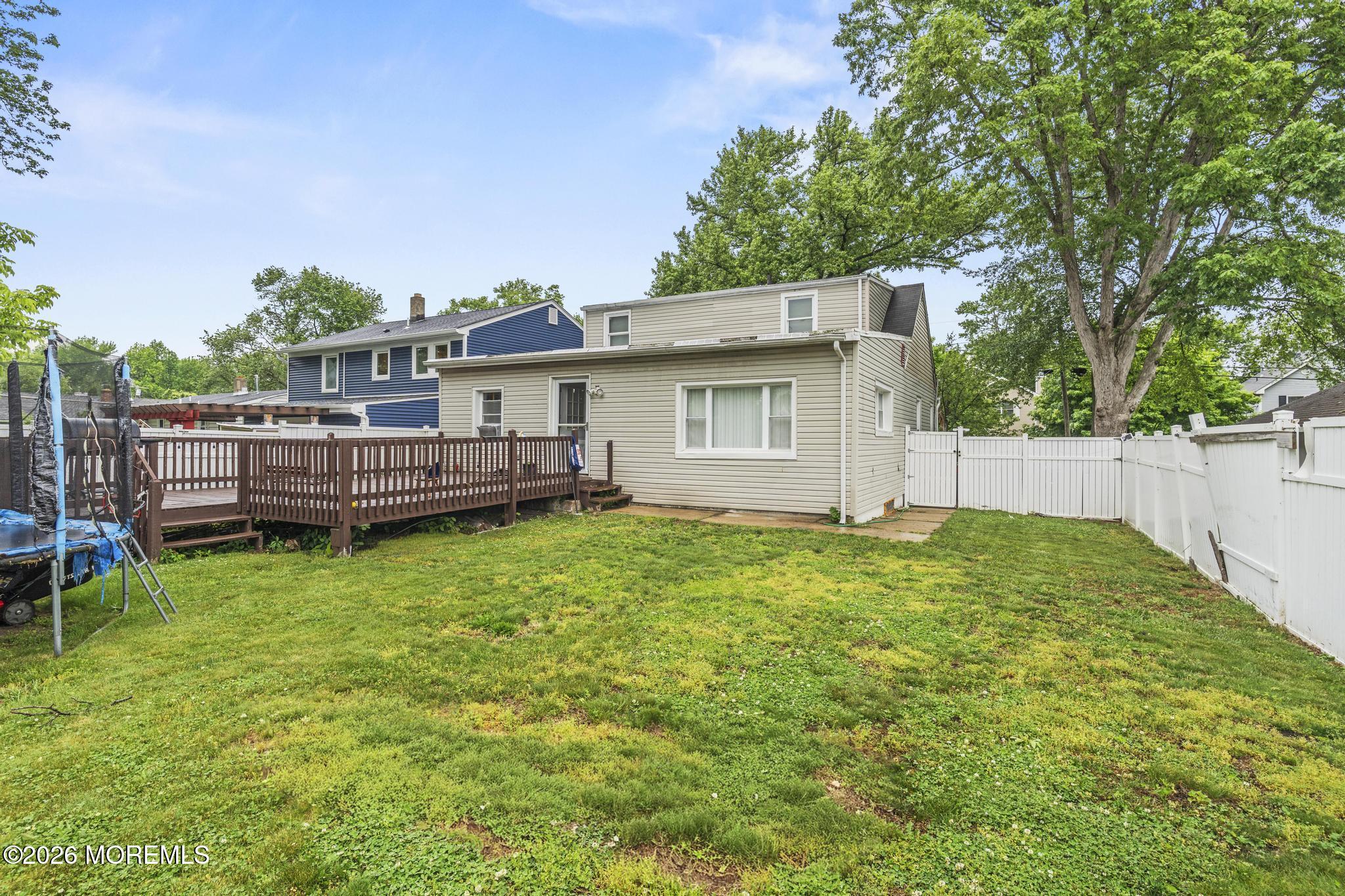 1914 Rutherford Avenue Neptune Township, NJ 07753 - Photo 25 of 25 a view of house with backyard space and seating