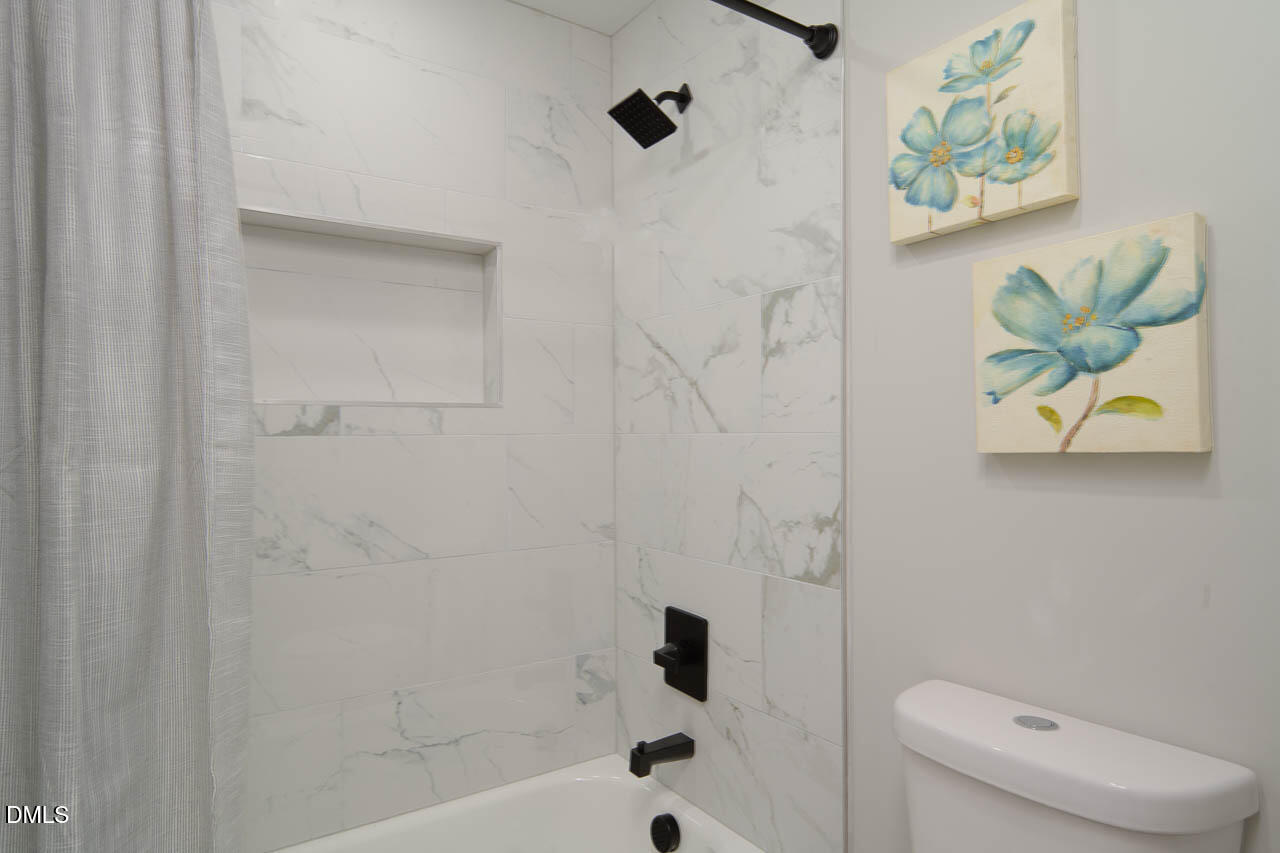 101 South Maple Street Durham, NC 27703 - Photo 27 of 27 a bathroom with a toilet and a shower