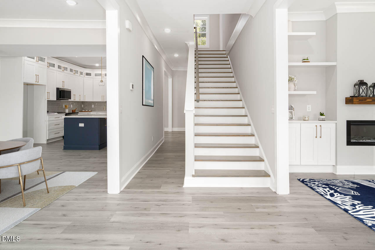101 South Maple Street Durham, NC 27703 - Photo 6 of 27 a view of a hallway with wooden floor and staircase