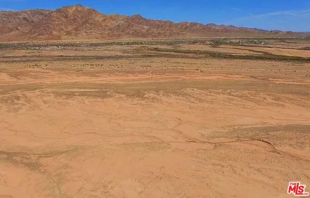 a view of an ocean and a mountain