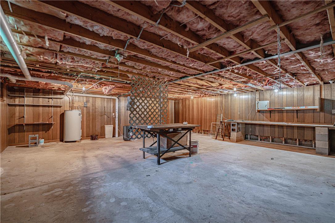 4815 Mill Road Schnecksville, PA 18078 - Photo 38 of 48 A spacious basement area offers ample storage and workbench space, perfect for projects.