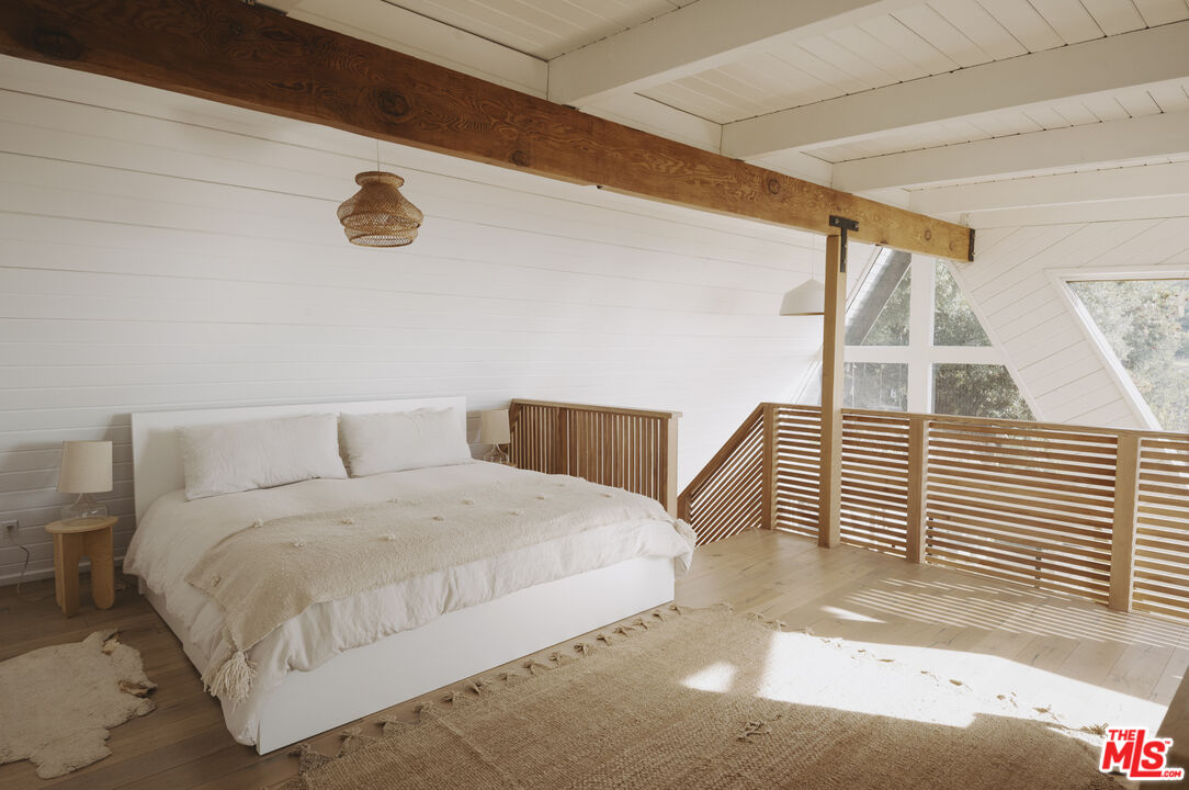 4828 Glenn Road Santa Barbara, CA 93105 - Photo 11 of 31 a bedroom with a bed and a large window
