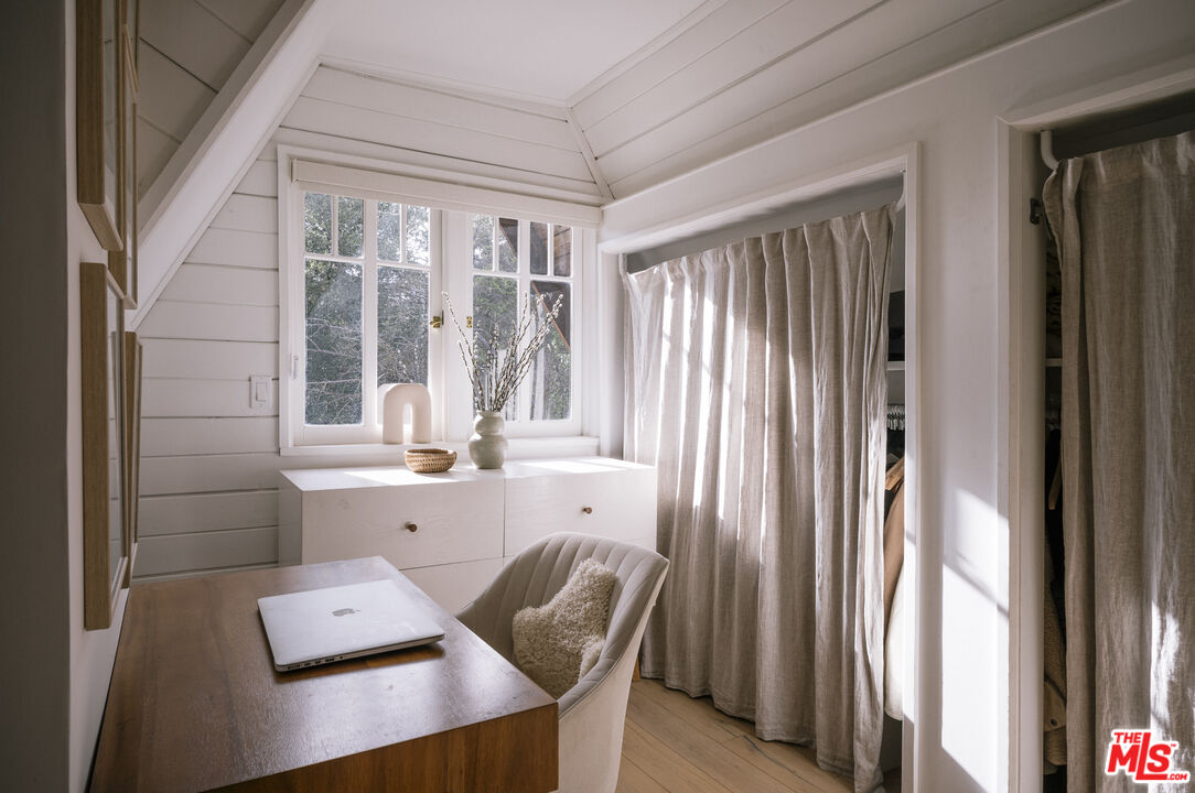 4828 Glenn Road Santa Barbara, CA 93105 - Photo 13 of 31 a view of a workspace with furniture and a window