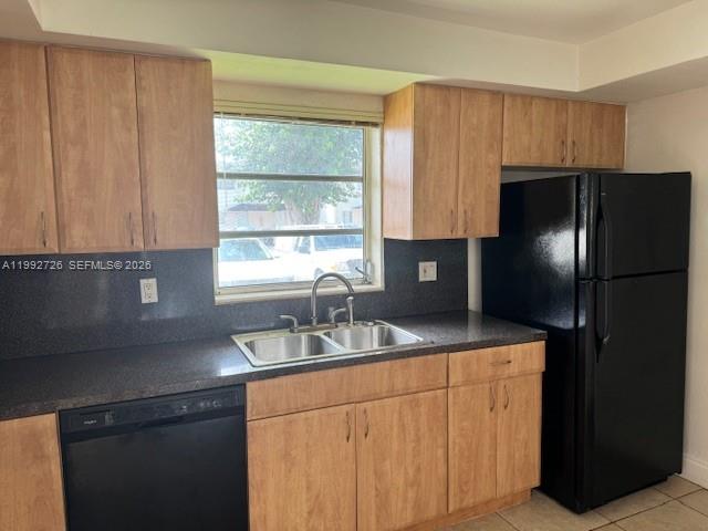 7350 Southwest 82nd Street, Unit C125 Miami, FL 33143 - Photo 2 of 12 a kitchen with stainless steel appliances granite countertop a refrigerator and a sink
