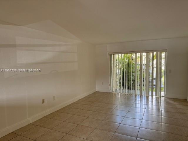 7350 Southwest 82nd Street, Unit C125 Miami, FL 33143 - Photo 3 of 12 a view of an empty room with a window