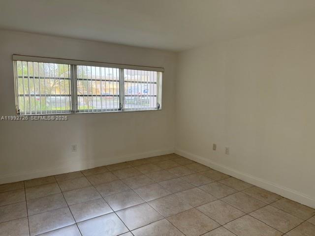 7350 Southwest 82nd Street, Unit C125 Miami, FL 33143 - Photo 4 of 12 a view of an empty room with a window