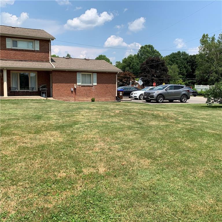 1362 Highland Road Sharon, PA 16146 - Photo 2 of 24 Back of house showing garage and extra parking.