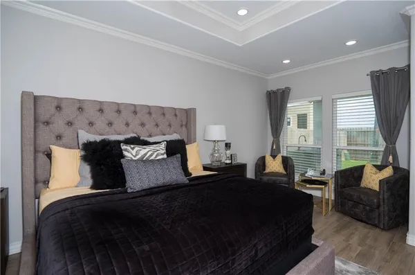 a bedroom with a bed and a couch