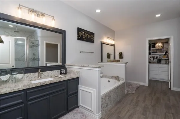 a bathroom with a double vanity sink and mirror