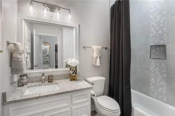 a bedroom with a bed and a television