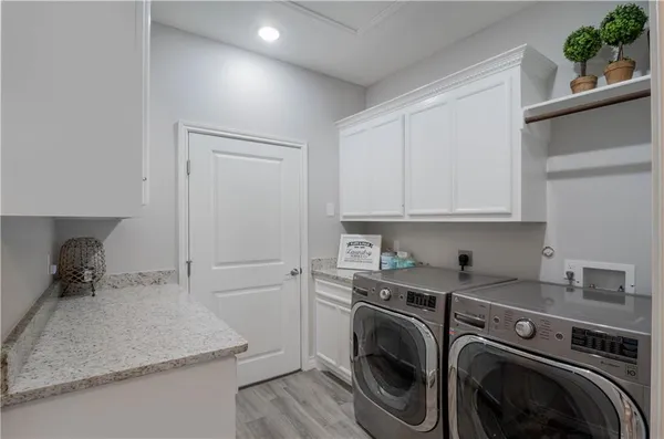 a kitchen with a stove and a refrigerator