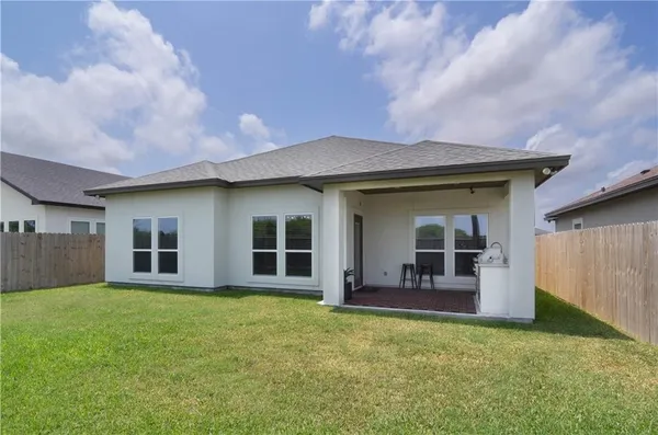 a view of a yard in front of a house with a yard