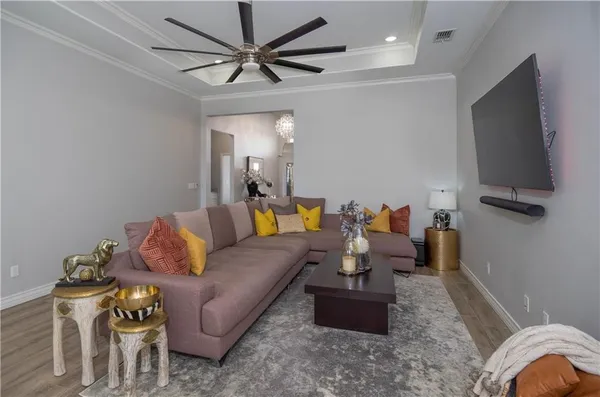a living room with furniture and a flat screen tv