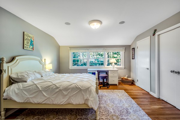 44 Myopia Road Winchester, MA 01890 - Photo 11 of 30 a bedroom with a bed and a large window