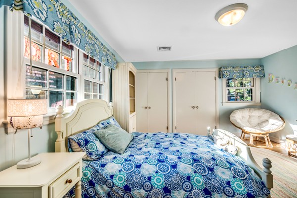 44 Myopia Road Winchester, MA 01890 - Photo 12 of 30 a bedroom with a bed and a lamp