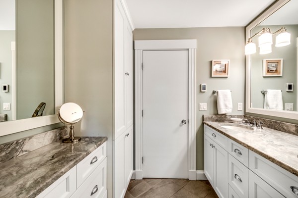 44 Myopia Road Winchester, MA 01890 - Photo 13 of 30 a bathroom with a granite countertop sink and a mirror