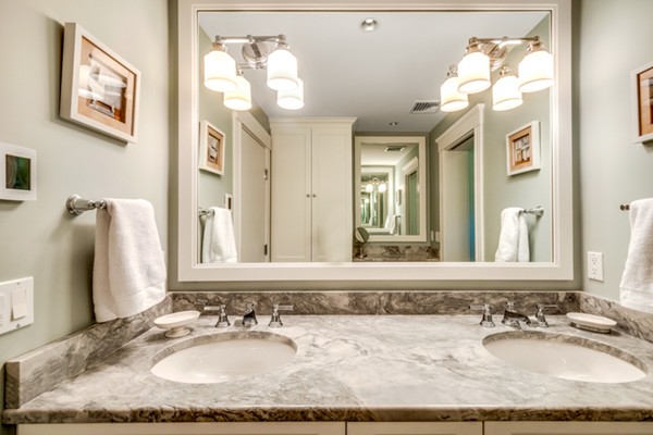 44 Myopia Road Winchester, MA 01890 - Photo 14 of 30 a bathroom with a granite countertop sink and a mirror