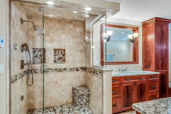 44 Myopia Road Winchester, MA 01890 - Photo 16 of 30 a bathroom with a granite countertop shower sink and mirror