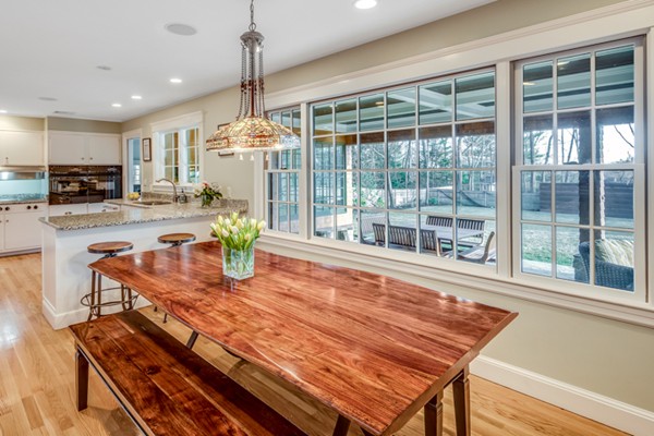 44 Myopia Road Winchester, MA 01890 - Photo 8 of 30 a dining room with furniture water view and a chandelier