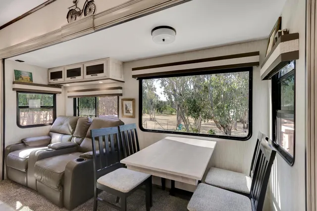 a view of a dining room with furniture window and outside view