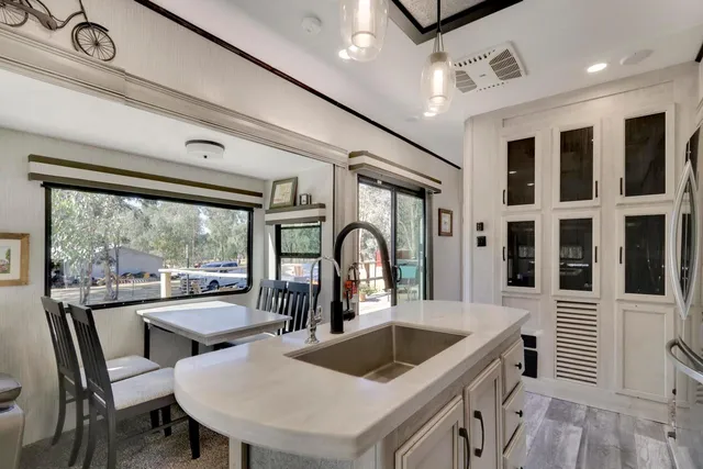 a bedroom with a large bed and a fireplace