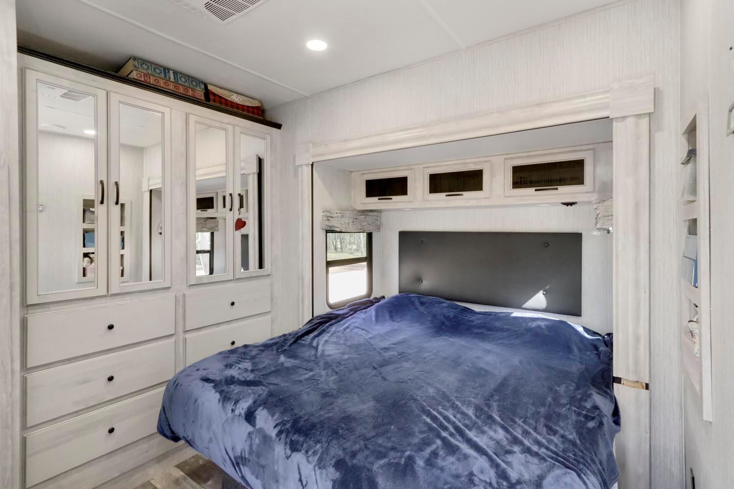 13435 Bennett Road Herald, CA 95638 - Photo 19 of 80 a bedroom with a large bed and a fireplace