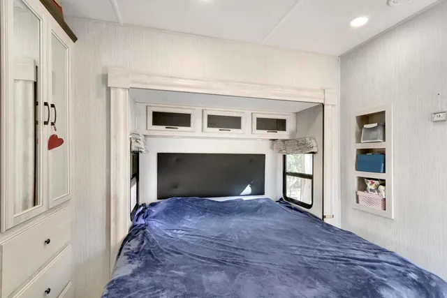 a front view of house with a garden