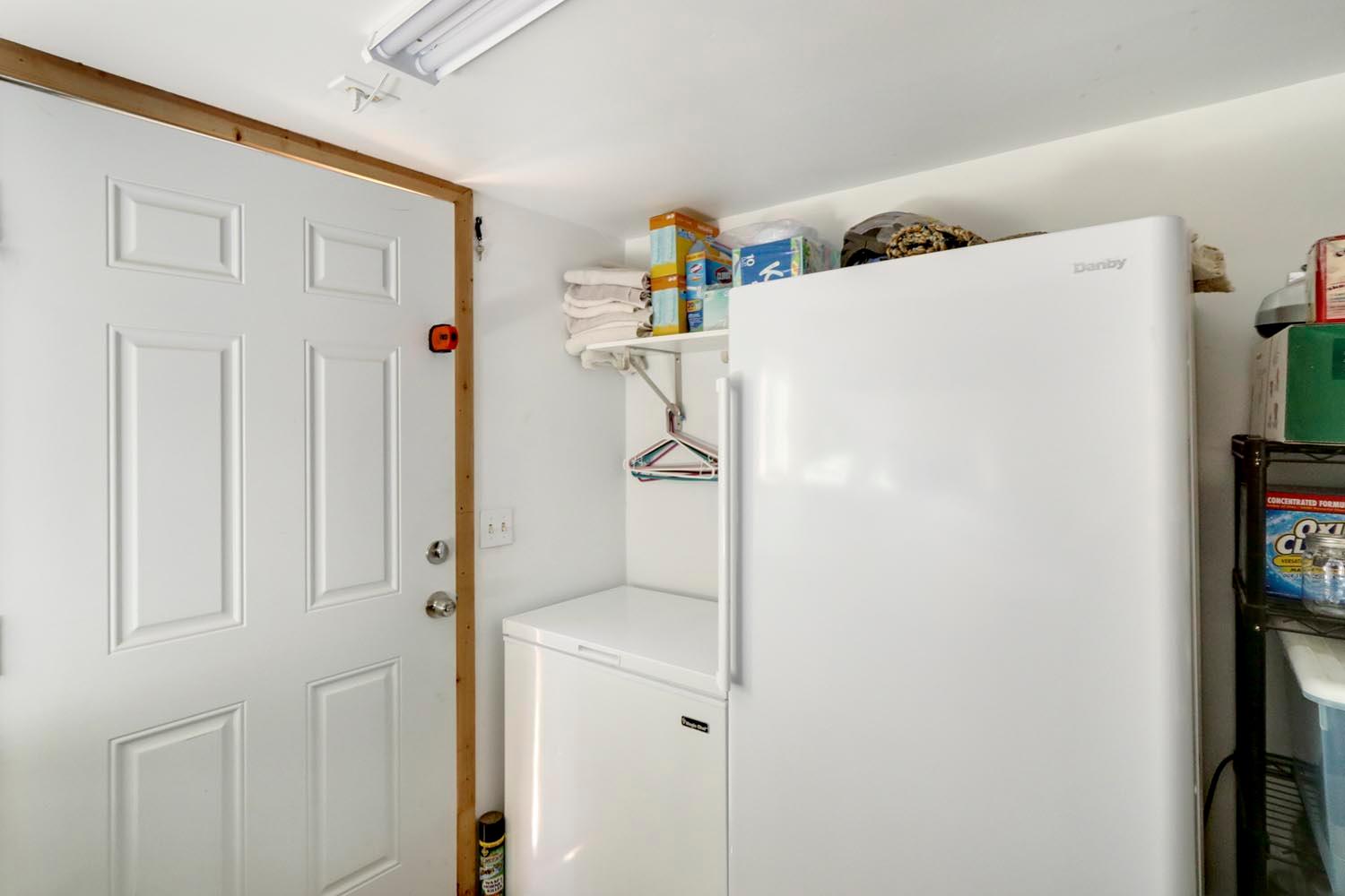 13435 Bennett Road Herald, CA 95638 - Photo 32 of 80 a white refrigerator freezer and a table in a room