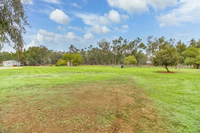 a view of a golf course with a lake