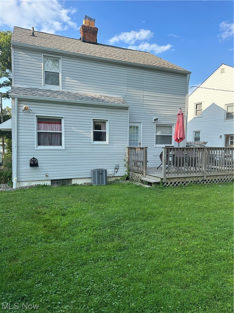 3894 Salisbury Road South Euclid, OH 44121 - Photo 14 of 16 Rear view of property featuring central AC, a lawn, and a deck