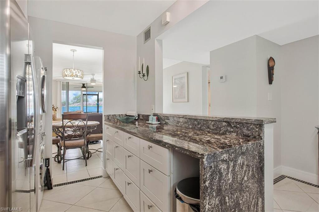 4380 27th Court Southwest, Unit 1 Naples, FL 34116 - Photo 11 of 34 Pass through to Dining area