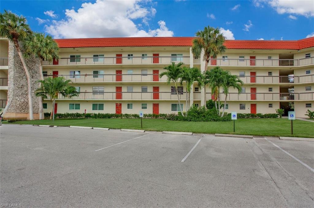 4380 27th Court Southwest, Unit 1 Naples, FL 34116 - Photo 3 of 34 View of condo front with parking