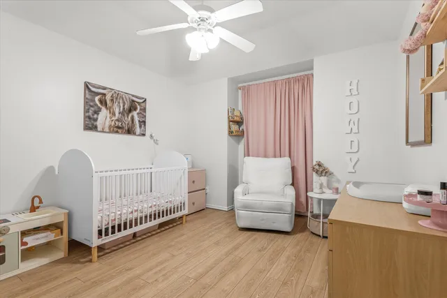 a bedroom with furniture and a window