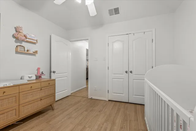 a view of hallway with wooden floor