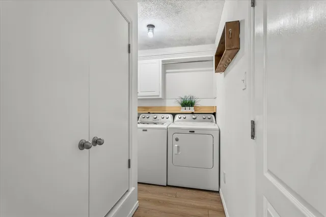 a utility room with closet dryer and washer