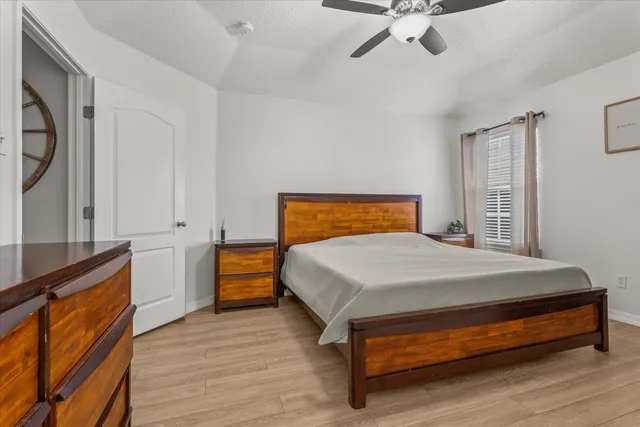 a bedroom with a bed and a dresser