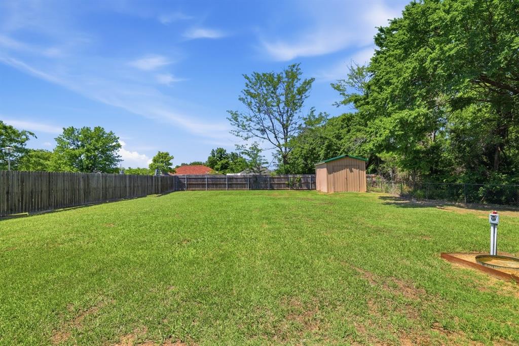 1974 County Road Powderly, TX 75473 - Photo 6 of 28 a view of a back yard